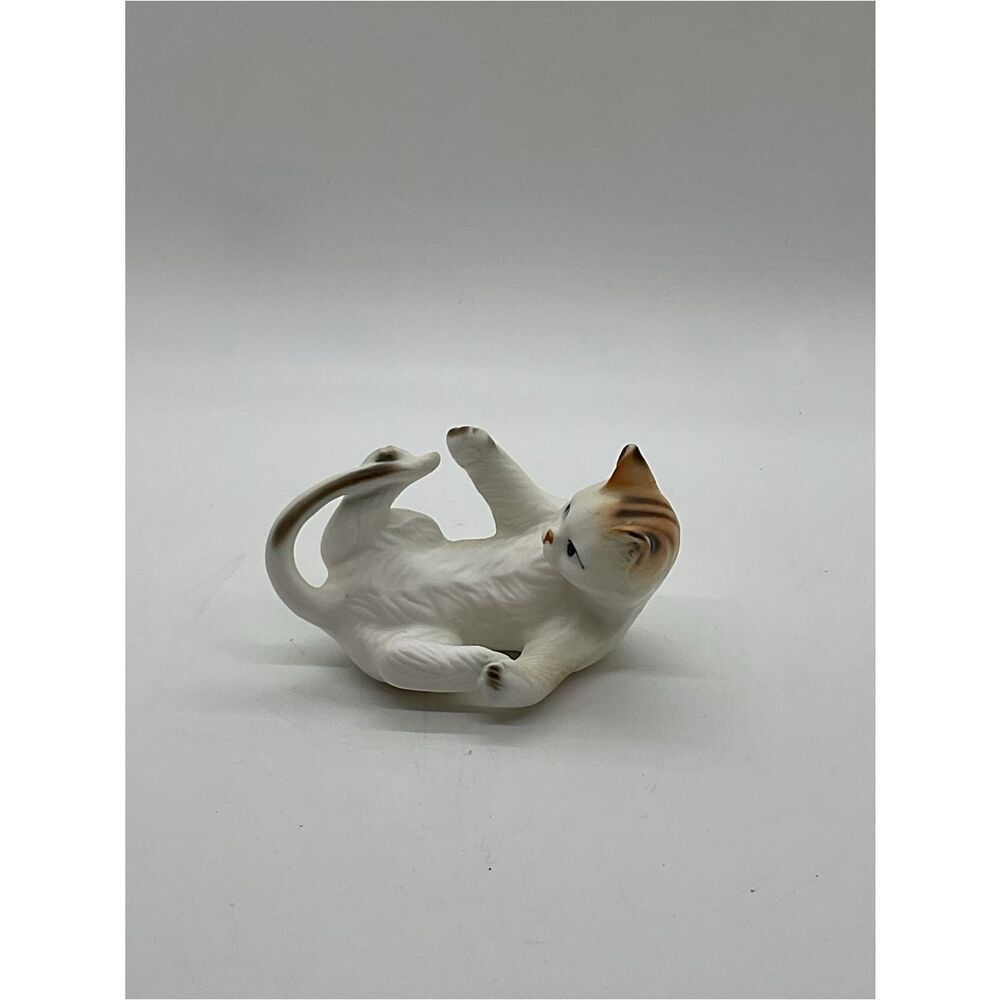 White and Tan Ceramic Cat Figurine - Catching Its Tail